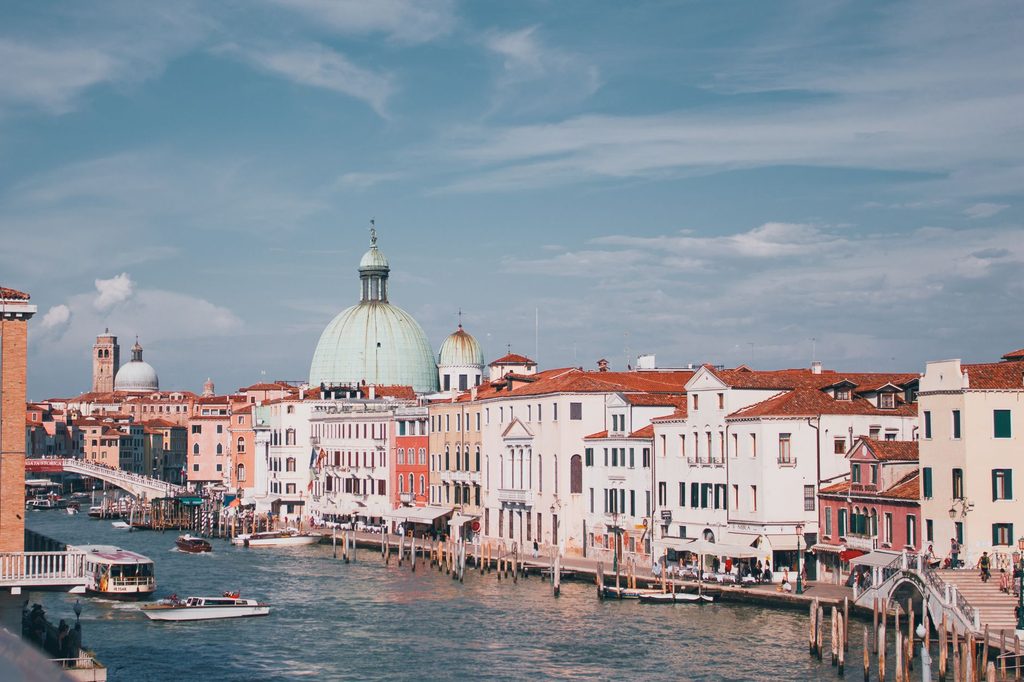 Grand Canal in Venice with Saint Mary of Health basilica, sun in Italy